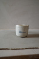 Warm white sculptural cup