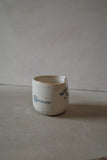 Warm white sculptural cup