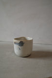 Warm white sculptural cup