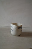 Warm white sculptural cup