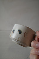 Small square earphone splodge mug