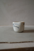 Warm white sculptural cup
