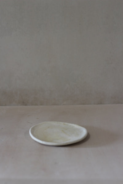 Wobbly matte white saucer- Salvaged ash glaze