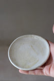 Wobbly matte white saucer- Salvaged ash glaze